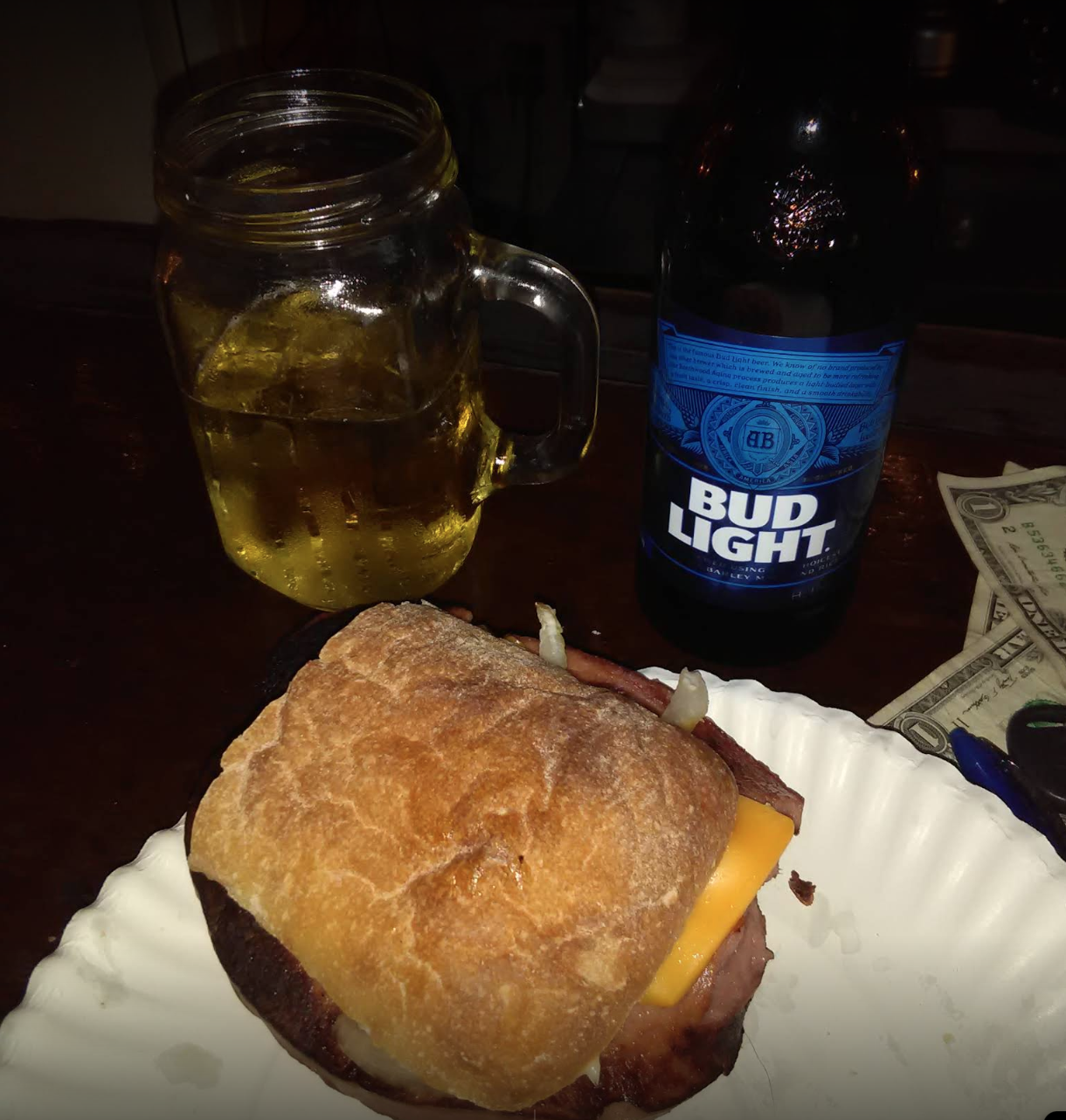 Close-up of sandwich and beer.